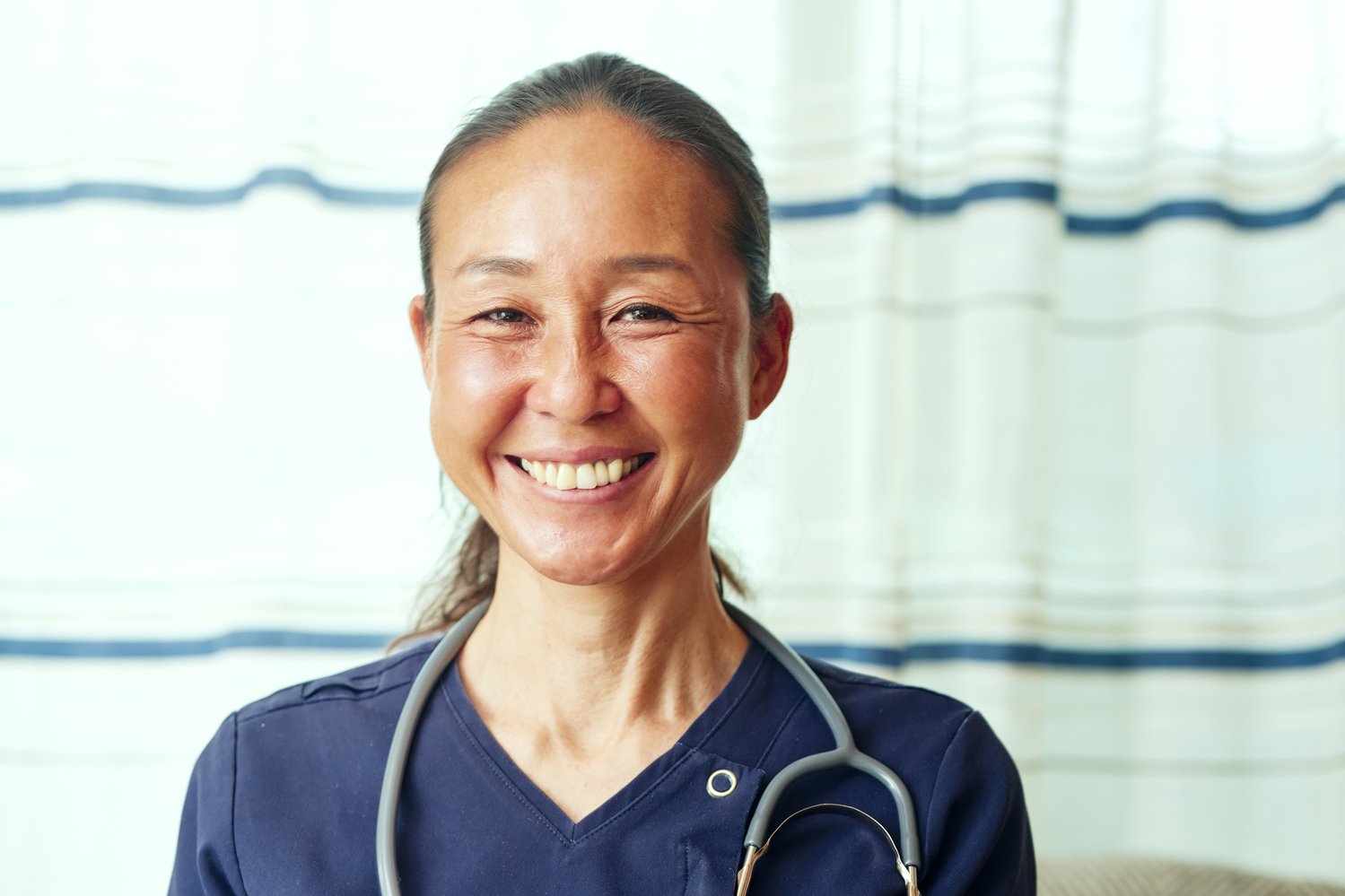 Female nurse smiling.